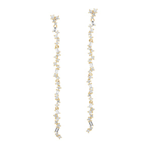 Scattered Diamond Dangle Earrings  -14K gold weighing 3.32 grams  -52 round prong-set diamonds totaling 0.75 carats  -12 prong-set straight baguettes totaling 0.31 carats.