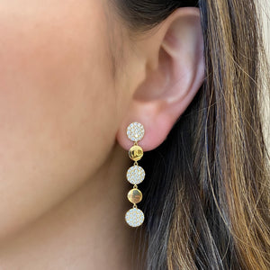 Female Model Wearing Pave Diamond Disc Dangle Earrings  -18K gold weighing 5.20 grams  -114 round pave-set diamonds totaling 1.46 carats