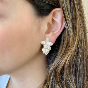 Female model wearing Diamond ornate flower crawler earrings -14K gold weighing 8.35 grams  -282 round diamonds totaling 2.14 carats