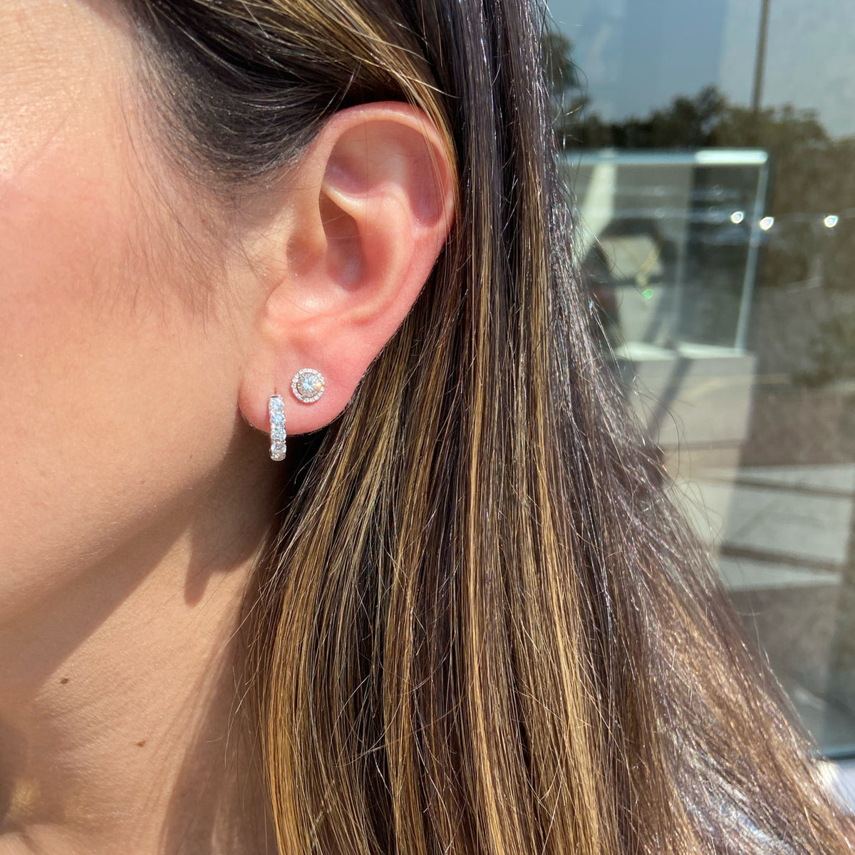 Female Model Wearing 0.78 ct Diamond Huggie Earrings - 14K gold weighing 2.20 grams  - 10 round diamonds weighing 0.78 carats