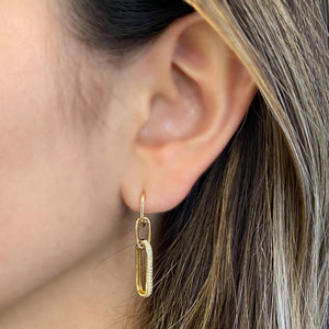 Female Model Wearing Diamond Paperclip Chain Dangle Earrings - 14K gold weighing 4.58 grams  - 76 round diamonds weighing 0.27 carats