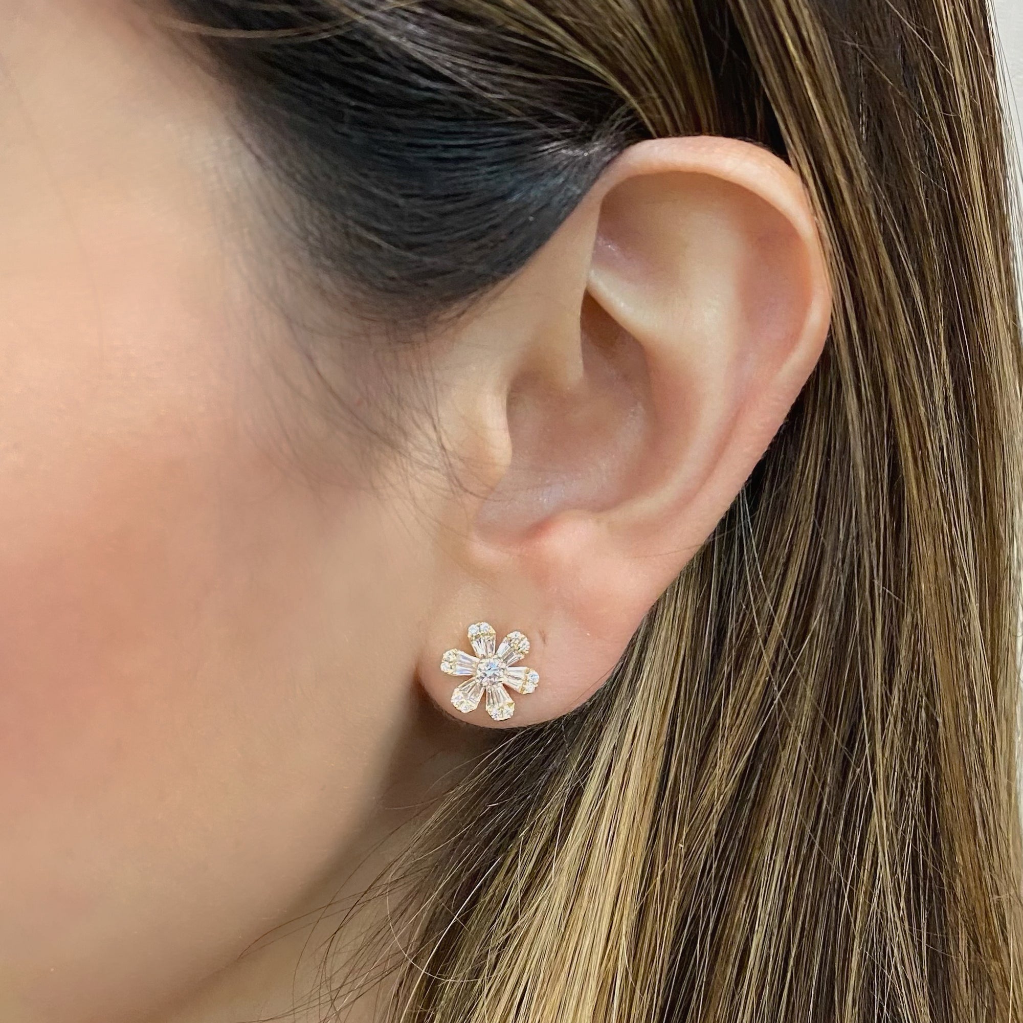 Round & Baguette Diamond medium flower stud earrings  - 14K gold weighing 3.21 grams  - 24 slim baguettes totaling 0.49 carats  - 26 round diamonds totaling 0.34 carats