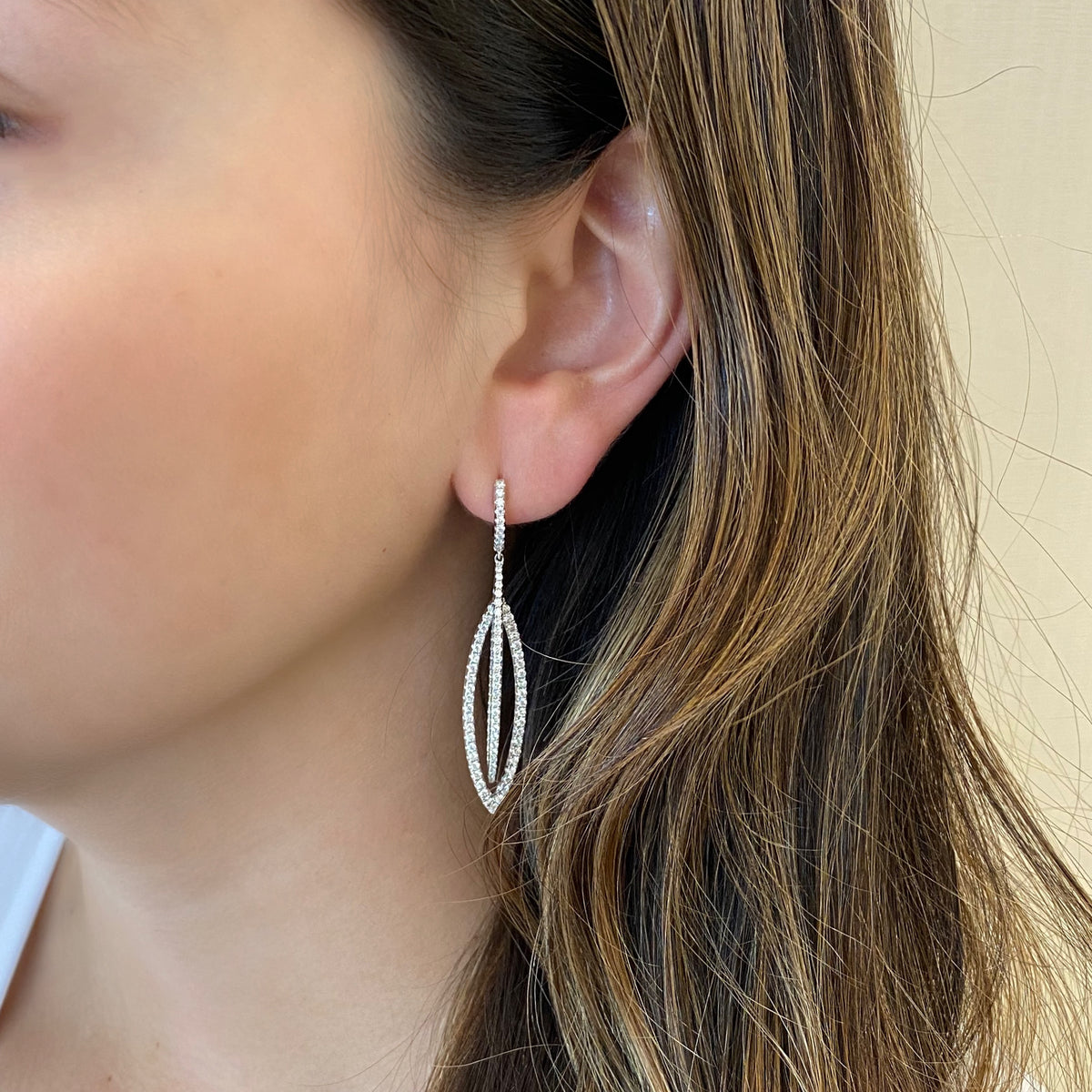 Female Model Wearing Diamond Double Marquise Drop Earrings   -14K gold weighing 8.88 grams  -202 round diamonds totaling 2.01 carats