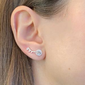 Female model wearing Graduated Diamond Arc Crawler Earrings - 14K gold weighing 1.13 grams - 28 round diamonds totaling 0.27 cts
