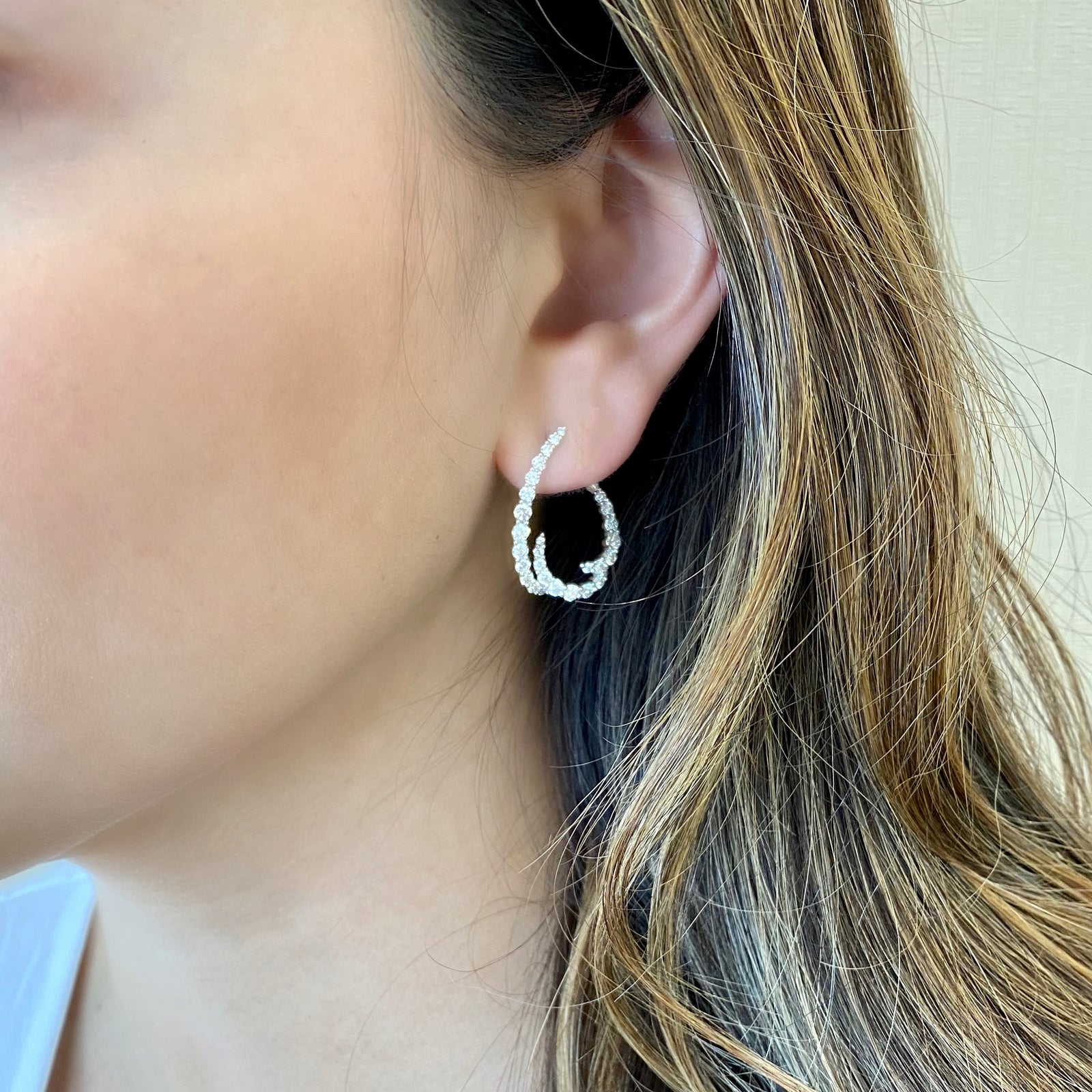 Diamond Open Swoop Earrings  -18K gold weighing 4.69 grams  -66 round diamonds totaling 1.89 carats