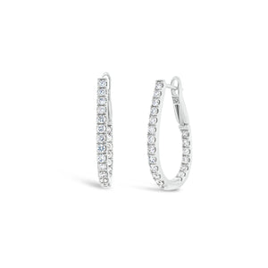 Inside-out diamond oval huggie earrings -18k gold weighing 3.91 grams -44 round diamonds weighing .67 carats
