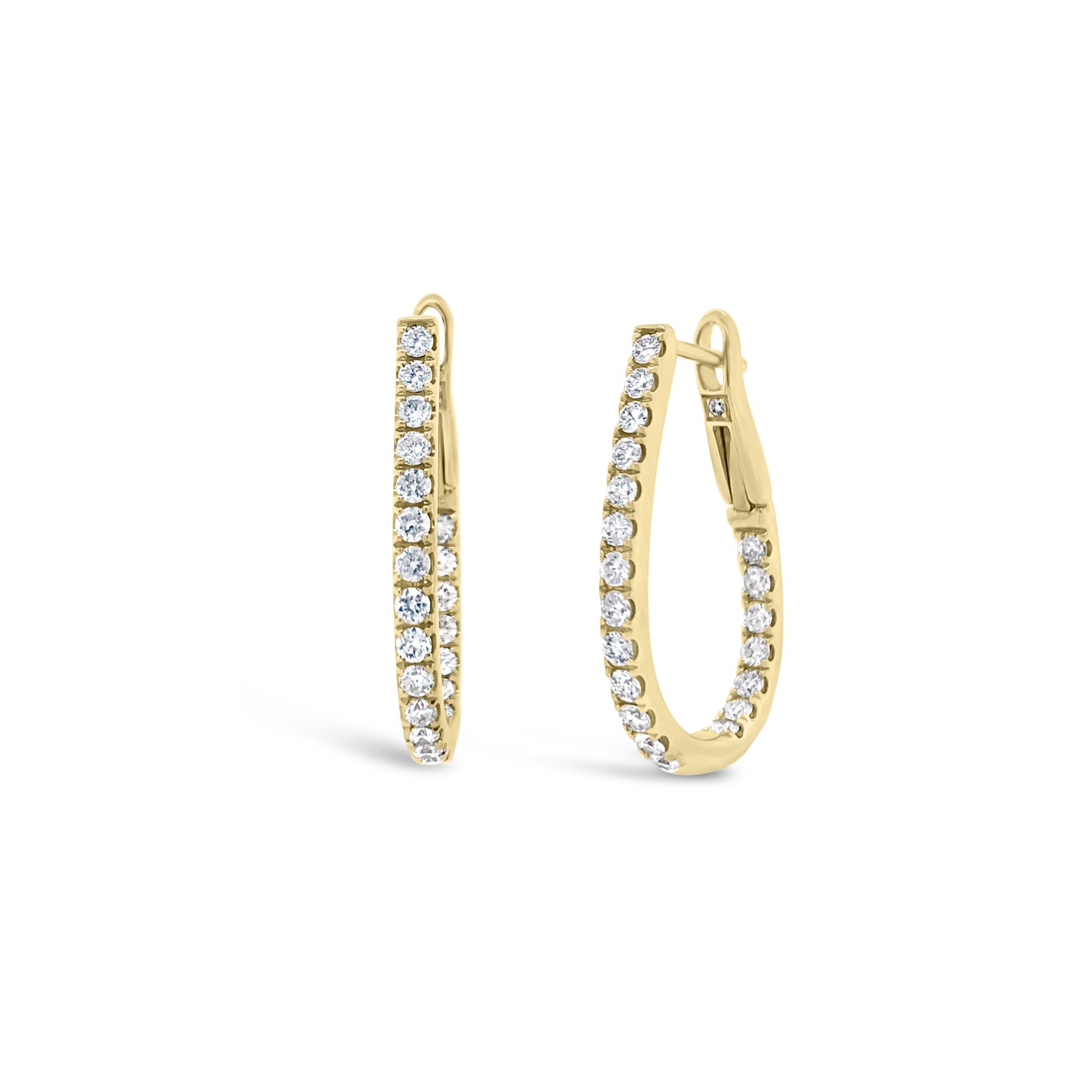 Inside-out diamond oval huggie earrings -18k gold weighing 3.91 grams  -44 round diamonds weighing .67 carats