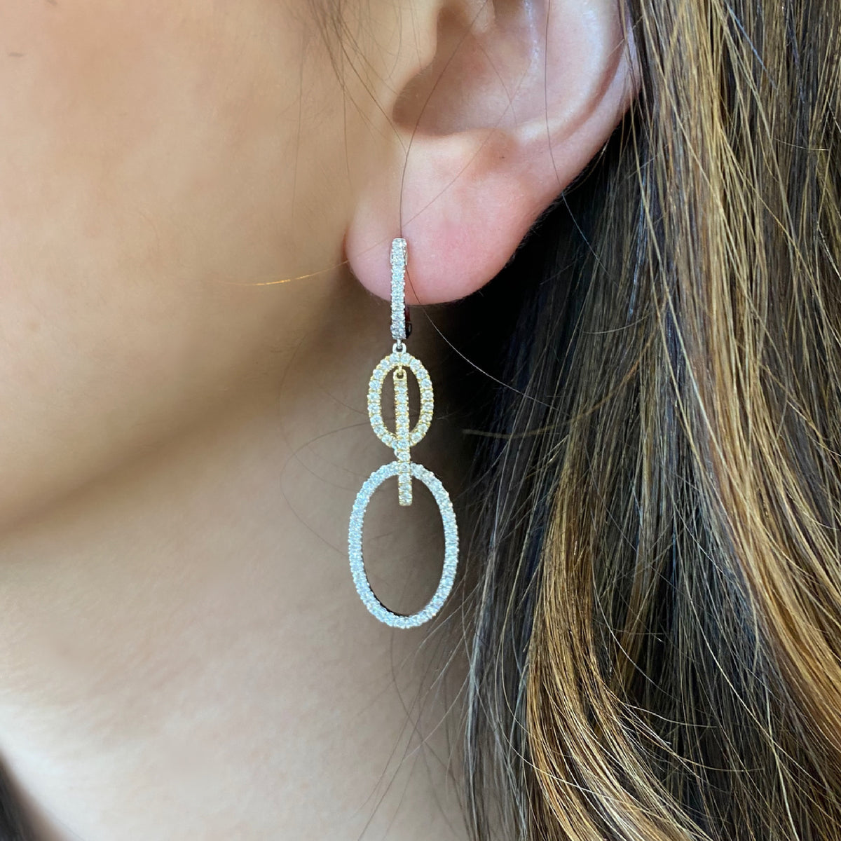 Diamond Oval Dangle Earrings  The ideal accessory for your next cocktail party or special occasion.  -18K gold weighing 7.23 grams  -186 round diamonds totaling 1.73 carats