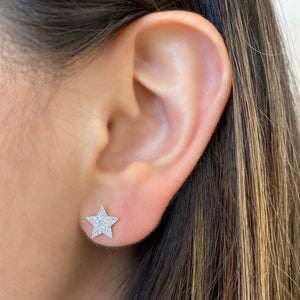 Female model wearing Pave Diamond Star Stud Earrings -14K gold weighing 1.26 grams -82 Round Diamonds weighing 0.20 cts