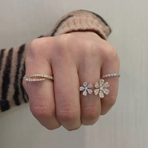 Female Model Wearing Diamond Flower Double Finger Ring  - 14K gold weighing 3.09 grams  - 57 round diamonds totaling 1.02 carats