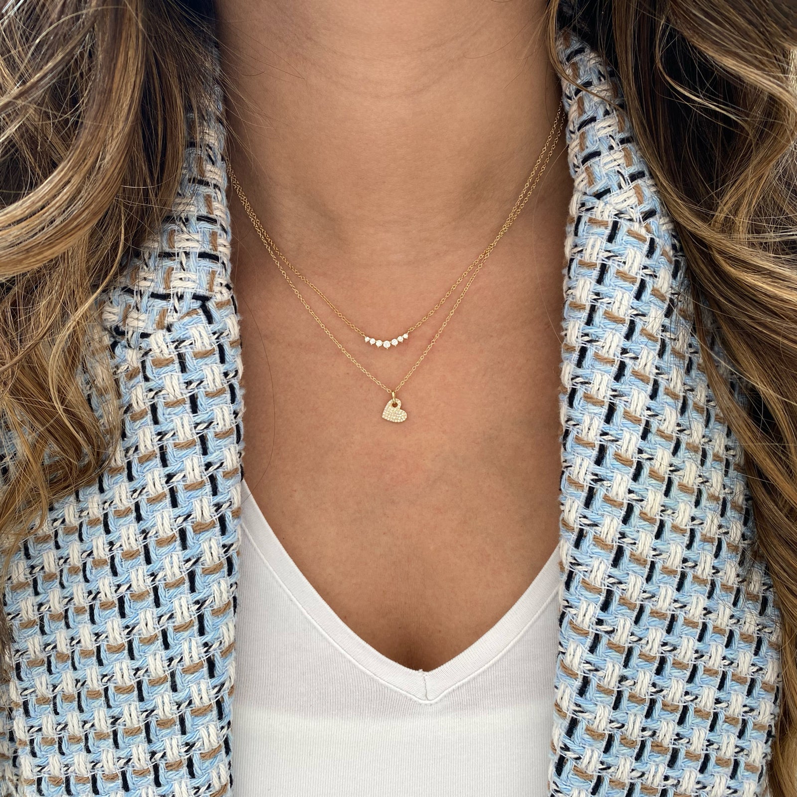 Graduated Diamond Bar Pendant  - 14K gold weighing 1.58 grams  - 7 round diamonds totaling 0.20 carats