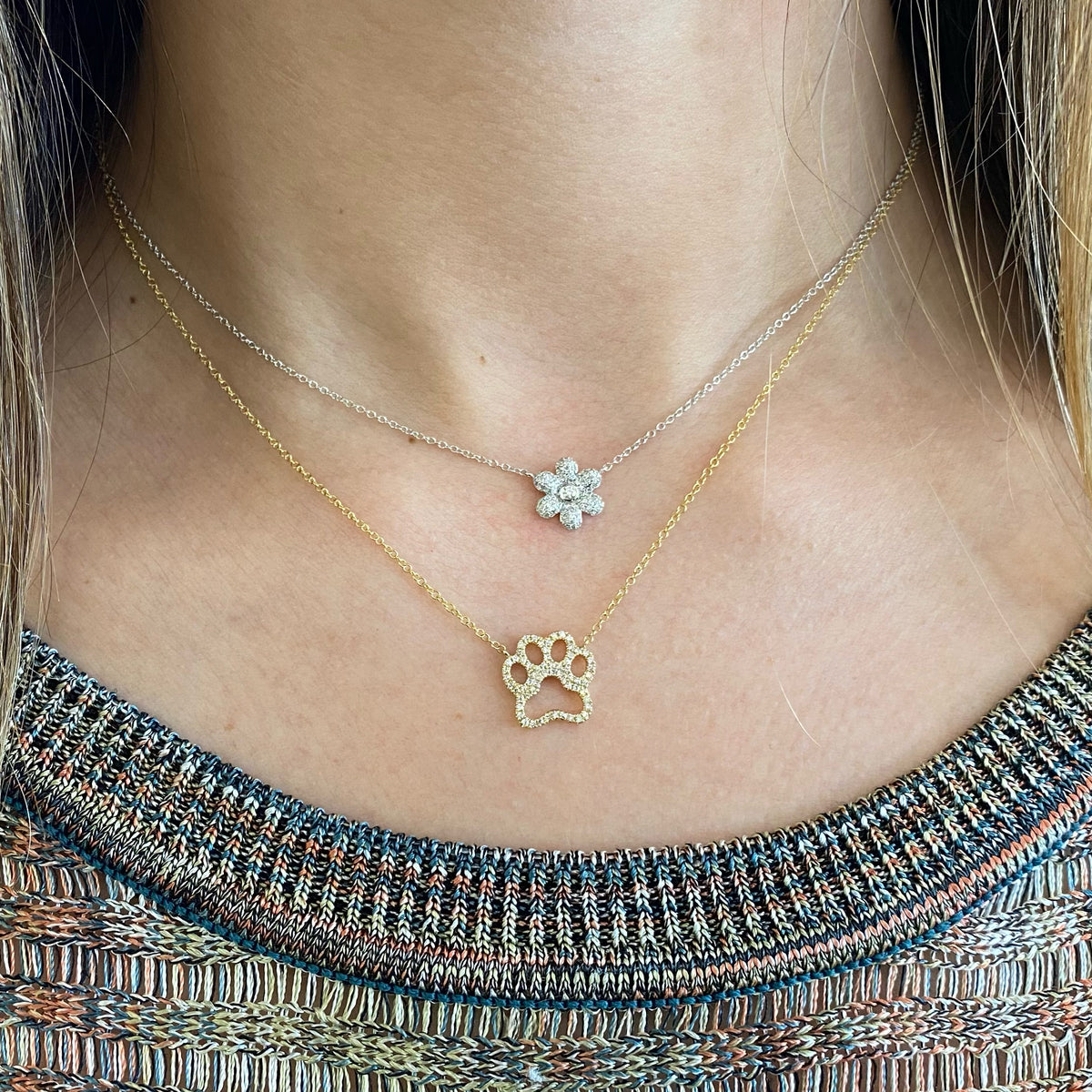 Female model wearing Diamond Daisy Necklace  - 14K white gold weighing 1.86 grams.   - 73 Round Diamonds totaling 0.22 carats.