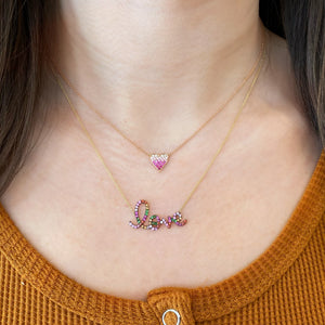 Female Model Wearing Sapphire Gradient Mini Pink Diamond Heart Pendant Necklace  -14K gold weighing 1.98 grams  -4 round diamonds totaling 0.05 carats  -21 sapphires totaling 0.24 carats