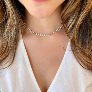 Female Model Wearing Diamond Dainty Spike Necklace  -14K gold weighing 5.0 grams  -87 round diamonds totaling 1.18 carats
