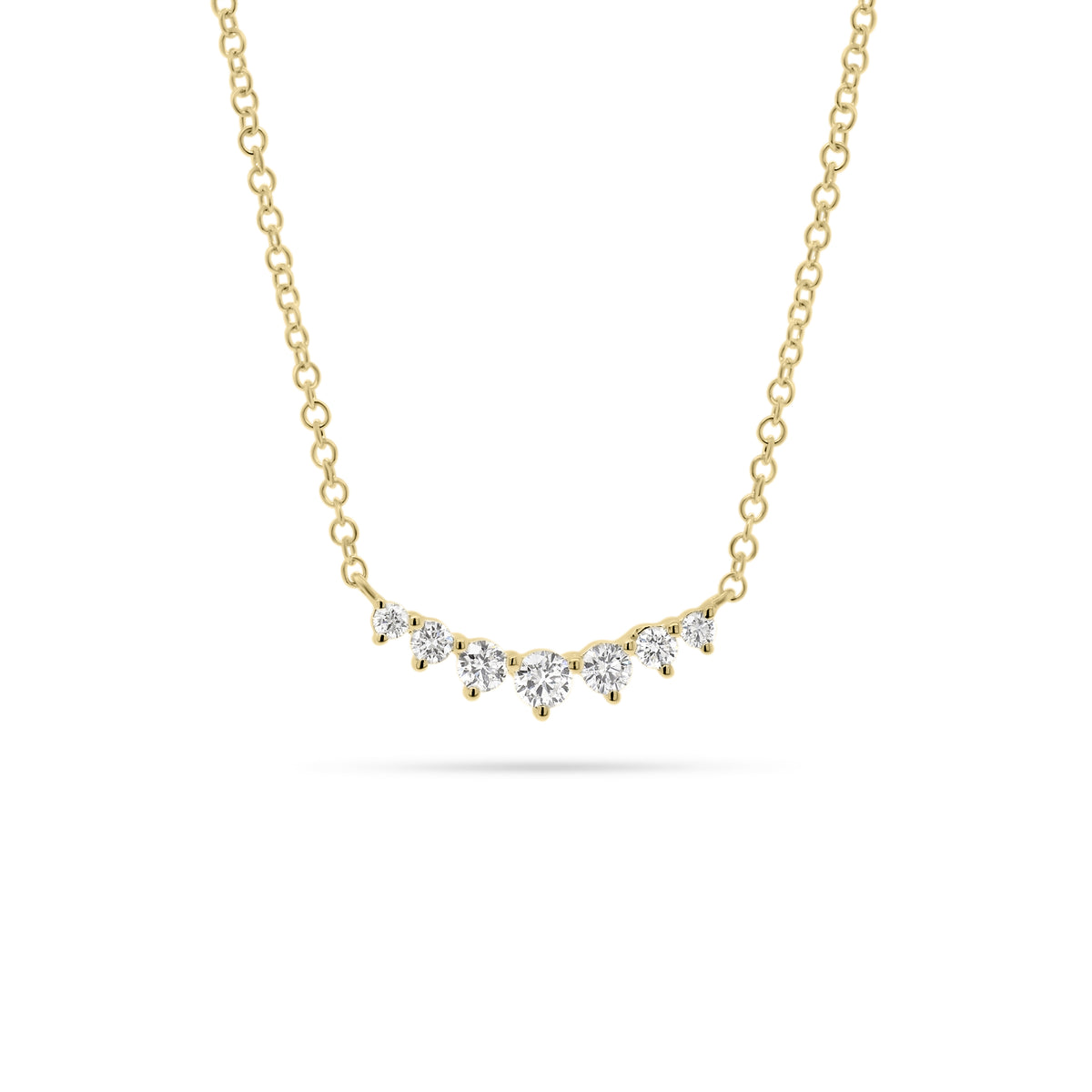 Graduated Diamond Bar Pendant  - 14K gold weighing 1.58 grams  - 7 round diamonds totaling 0.20 carats