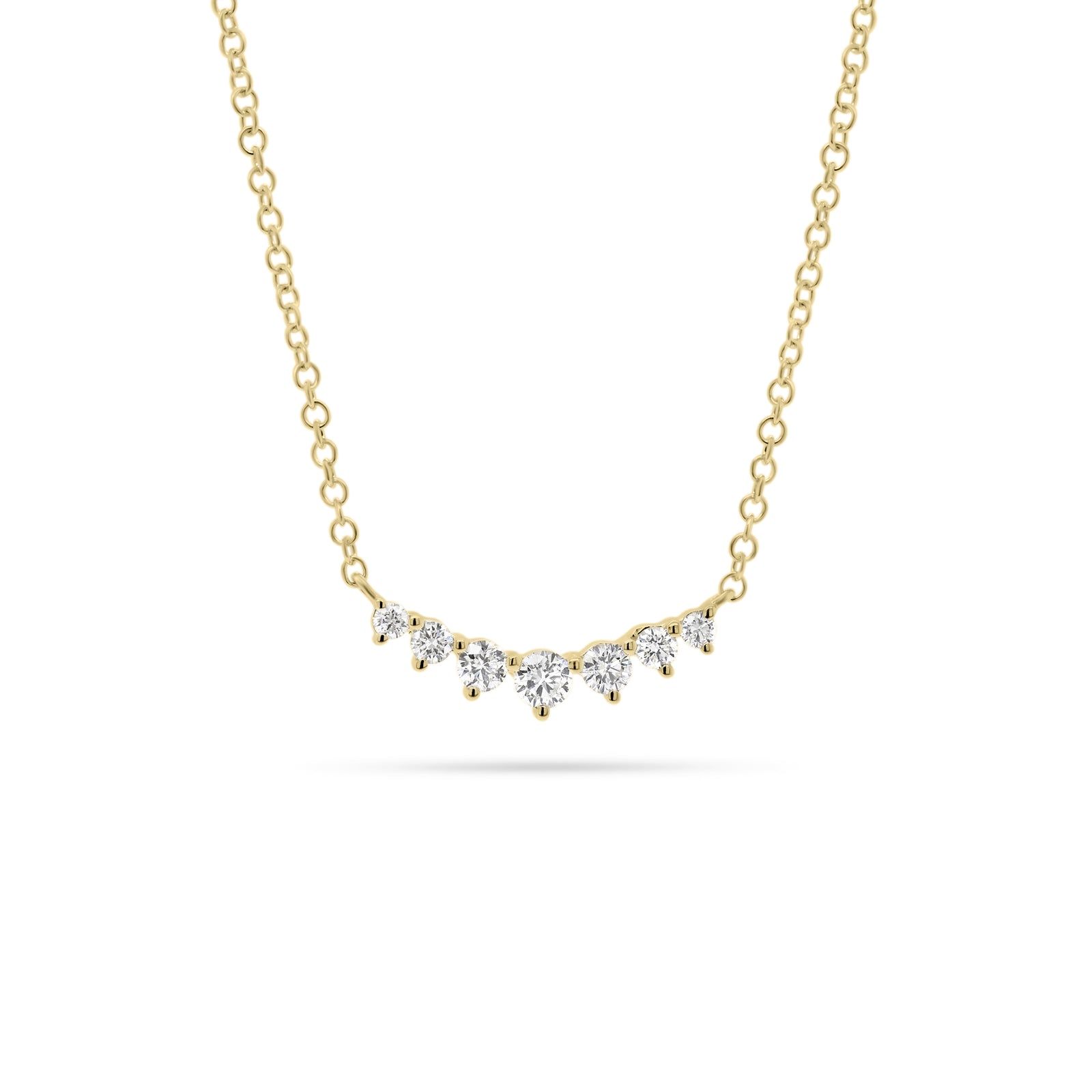 Graduated Diamond Bar Pendant  - 14K gold weighing 1.58 grams  - 7 round diamonds totaling 0.20 carats