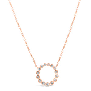 Bezel-Set Diamond Open Circle Pendant Necklace - 14K rose gold weighing 2.28 grams. - 15 Round Diamonds totaling 0.27 carats.