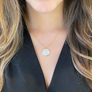 Female Model Wearing Pink Mother of Pearl Pendant with Diamond Moon & Stars   - 14K gold weighing 2.92 grams.  - 103 round diamonds totaling 0 .24 carats.   - 1 Mather of pearl weighing 2.92 carats.