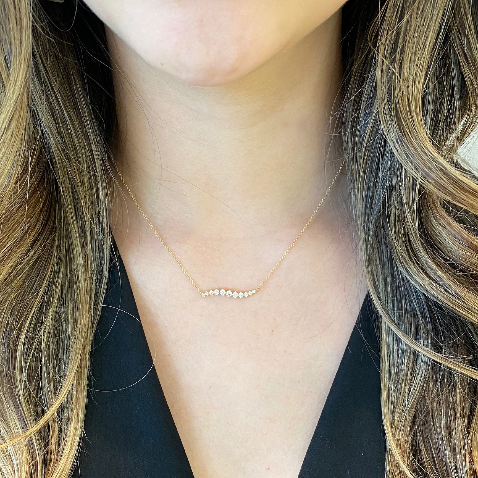 Diamond Wave Bar Necklace.  -14K gold weighing 1.83 grams  -11 round diamonds totaling 0.37 carats