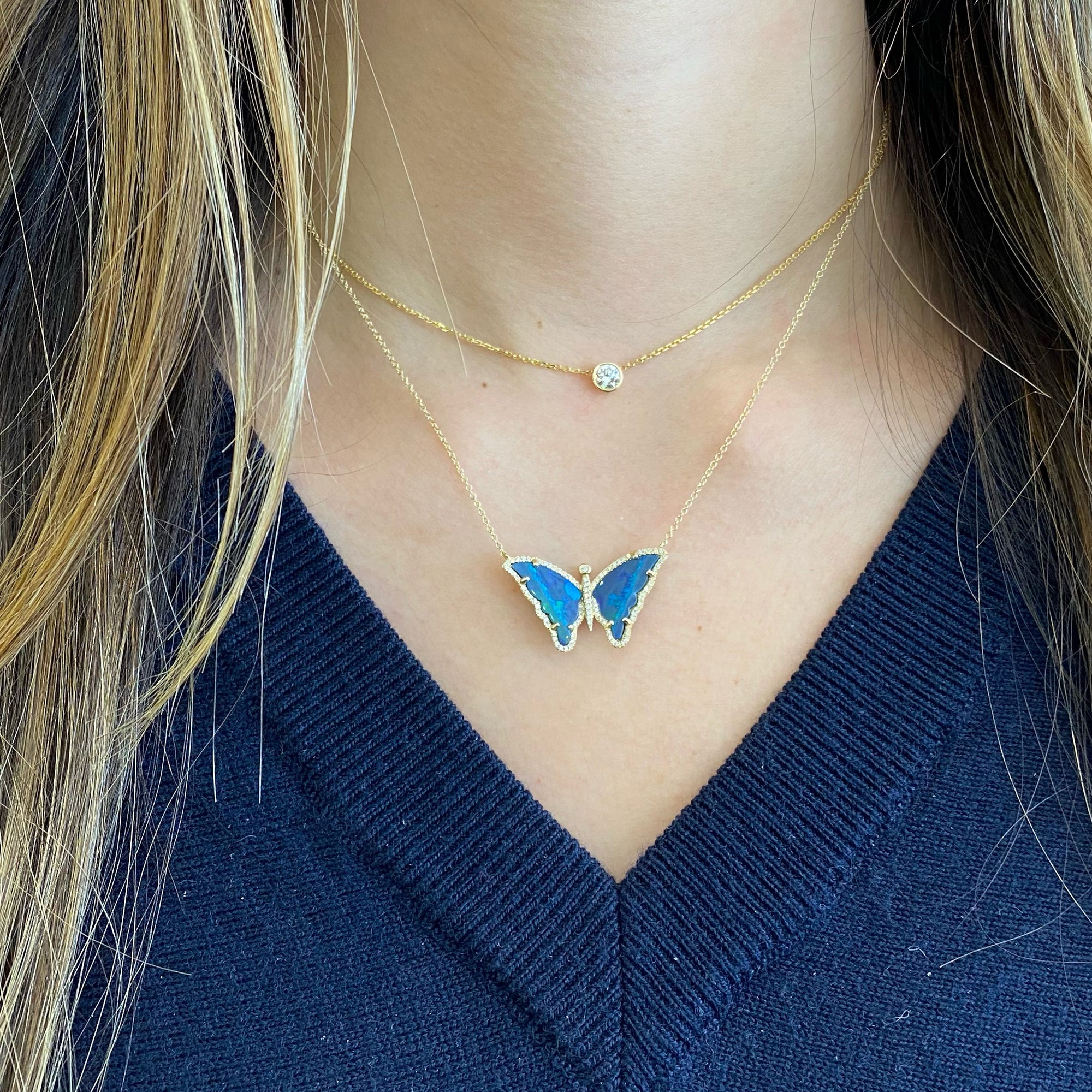 Opal & Diamond Butterfly Necklace  - 14K gold weighing 3.27 grams  - 2 opal weighing 1.93 carats  - 91 round diamonds totaling 0.23 carats