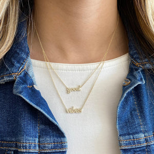 Female Model Wearing Diamond Good Vibes Necklace  - 14K gold weighing 2.73 grams  - 100 round diamonds totaling 0.22 carats