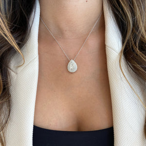 Female Model Wearing Solid 18K white gold weighing 3.78 grams with 60 round diamonds weighing 1.89 carats Pave Diamond Teardrop Pendant Necklace | Nuha Jewelers