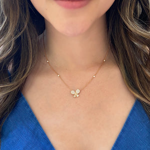 Female Model Wearing Diamond Butterfly Pendant Necklace with Diamond Bezels-18K gold weighing 4.43 grams  -56 round diamonds totaling 0.57 carats