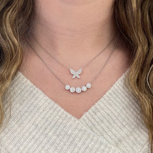 Female model wearing Pave Diamond Butterfly Pendant Necklace - 14K gold weighing 2.14 grams  - 94 round diamonds weighing 0.29 carats