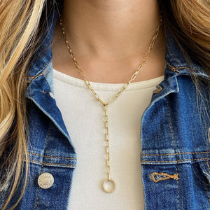 Female Model Wearing Diamond Circle Lariat Necklace with Paperclip Chain  - 14K gold weighing 10.97 grams  - 142 round diamonds totaling 0.39 carats