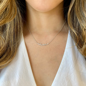 Female Model Wearing Diamond Confetti Bar Pendant - 14K gold weighing 3.34 grams  - 16 round diamonds totaling 0.45 carats