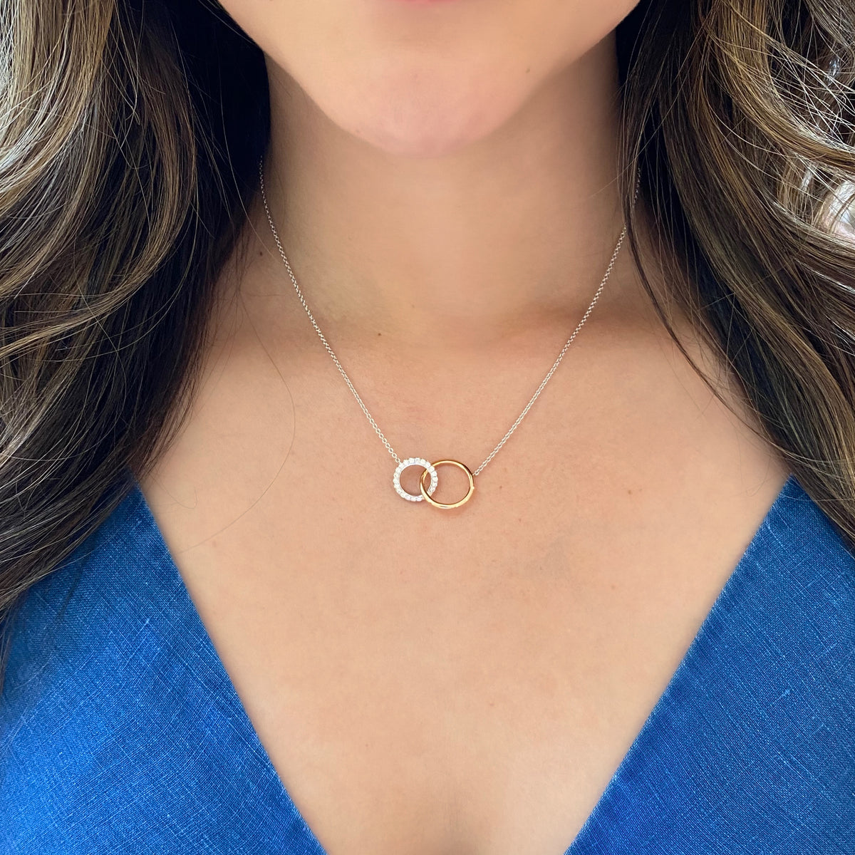 Female Model Wearing Diamond Interlocking Links Necklace  -18K gold weighing 5.46 grams   -44 round diamonds totaling 0.59 carats