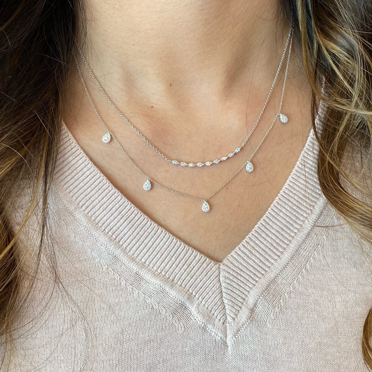 Female Model Wearing Diamond Marquise Bar Pendant  - 14K gold weighing 3.18 grams  - 9 marquise-shaped diamonds weighing 0.48 carats