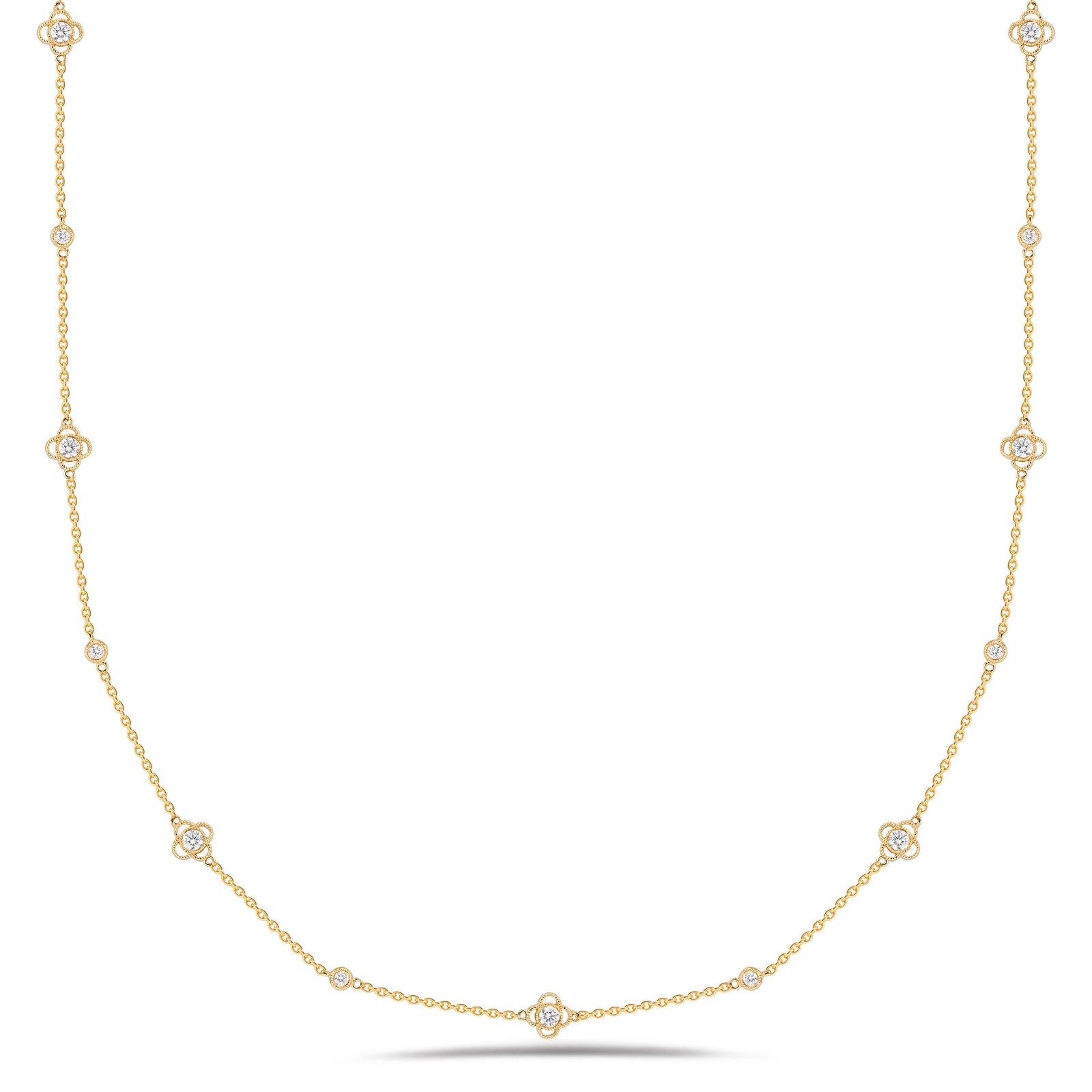 Diamonds by the Yard with Trefoils  - 14K gold weighing 5.83 grams  - 15 round diamonds totaling 0.90 carats