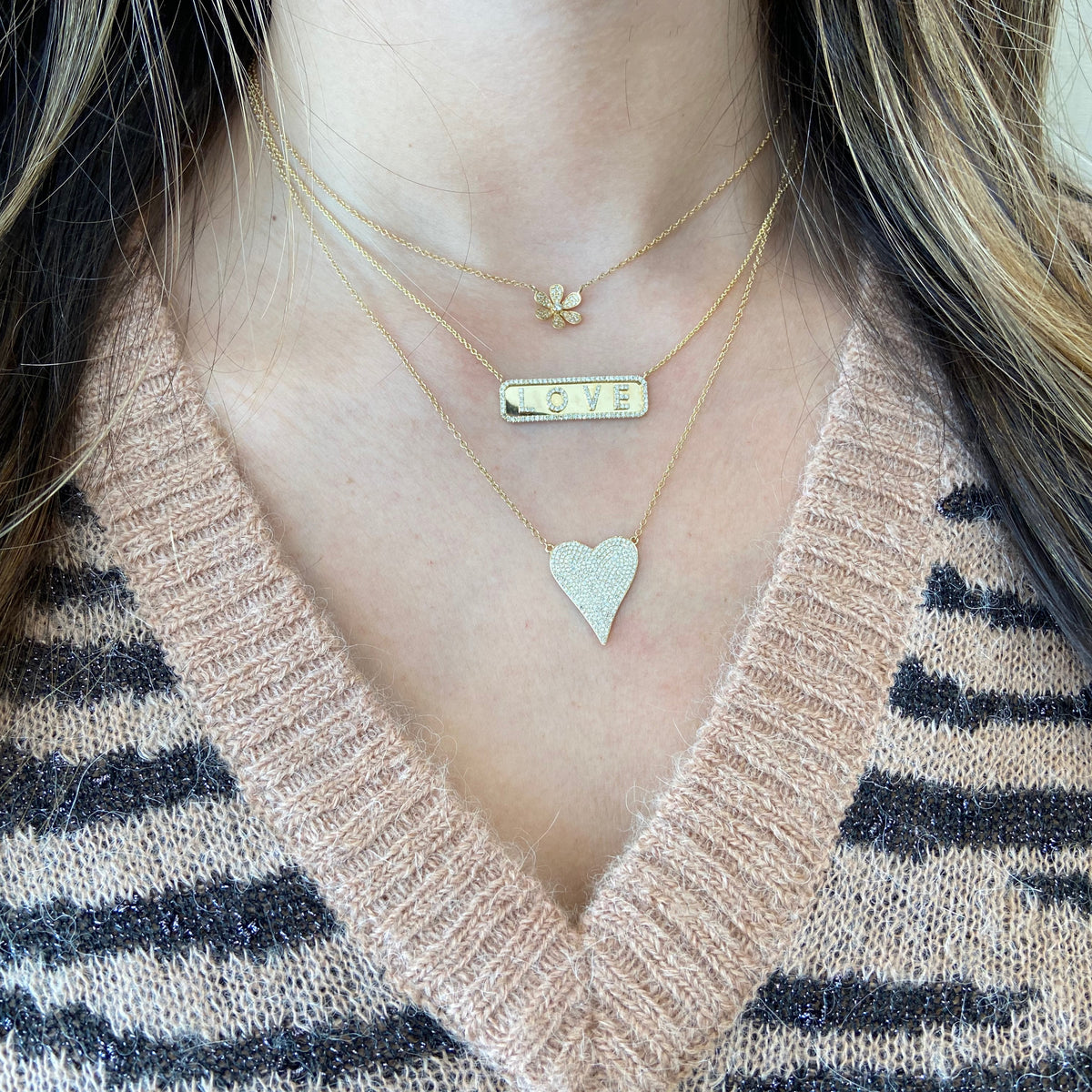 Female Model Wearing Round Diamond Daisy Necklace  - 14K gold weighing 1.80 grams  - 37 round diamonds totaling 0.12 carats