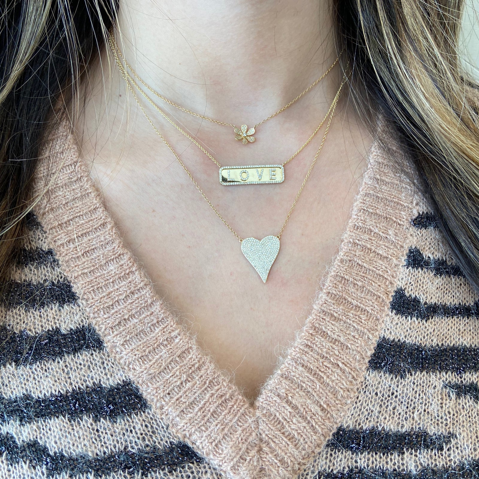 Diamond Elongated Heart Pendent  - 14K gold weighing 3.17 grams  - 282 round diamonds totaling 0.62 carats