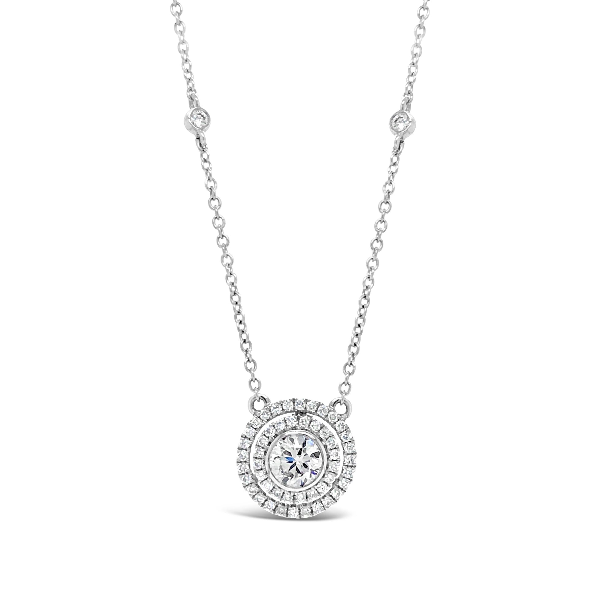 Diamond Double Halo Pendant Necklace  -18k gold weighing 3.31 grams  -50 round diamonds totaling 0.29 carats  -1 round diamonds 0.45 carats (G-color, VS1 clarity)
