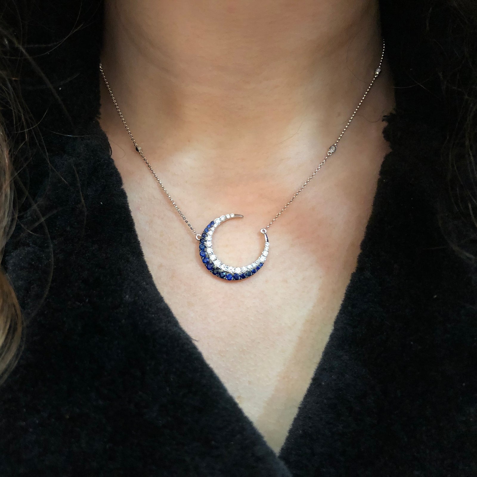 Sapphire & Diamond Crescent Moon Pendant Necklace  -14K gold weighing 5.60 grams  -27 round diamonds totaling 0.85 carats  -18 sapphires totaling 0.80 carats