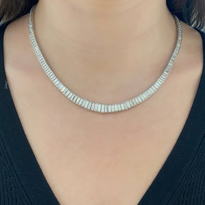 Woman Wearing Our Diamond Baguette Tennis Necklace - Platinum weighing 65.60 grams - 185 straight baguettes totaling 26.55 carats (GIA-graded D-E color, VS2+ clarity)
