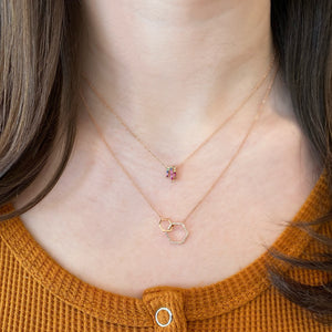 Female model wearing Diamond & Rainbow Gemstone Trio Necklace -14K gold weighing 2.02 grams -7 round prong-set diamonds totaling .05 carats -43 multicolor prong-set gemstones totaling 0.33 carats.