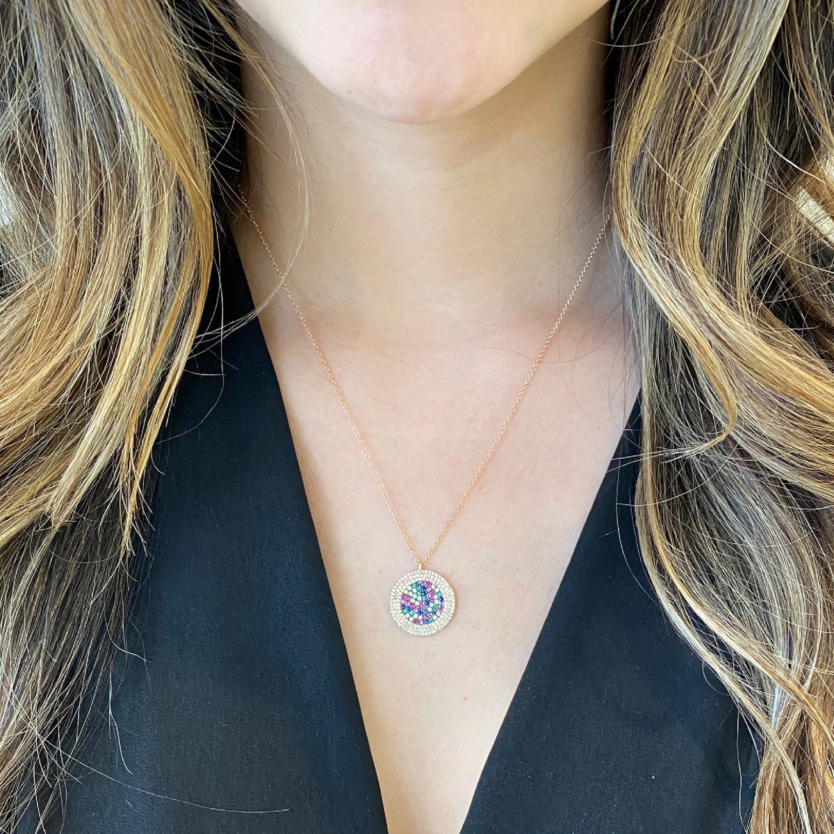 Female Model Wearing Multicolor Gemstone & Diamond Disc Pendant Necklace  -14K gold weighing 3.61 grams  -152 round bezel-set diamonds totaling 0.45 carats  -51 multicolor gemstones totaling 0.40 carats