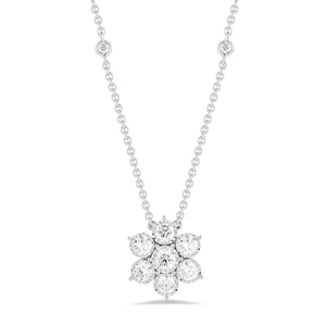 Diamond Flower Pendant with Bezel-Set Diamond Chain  -18K gold weighing 4.53 grams  -7 round bezel-set diamonds totaling 1.06 carats (pendant)  -4 round bezel-set diamonds totaling .08 carats (chain)  Size diameter 14 millimeters.