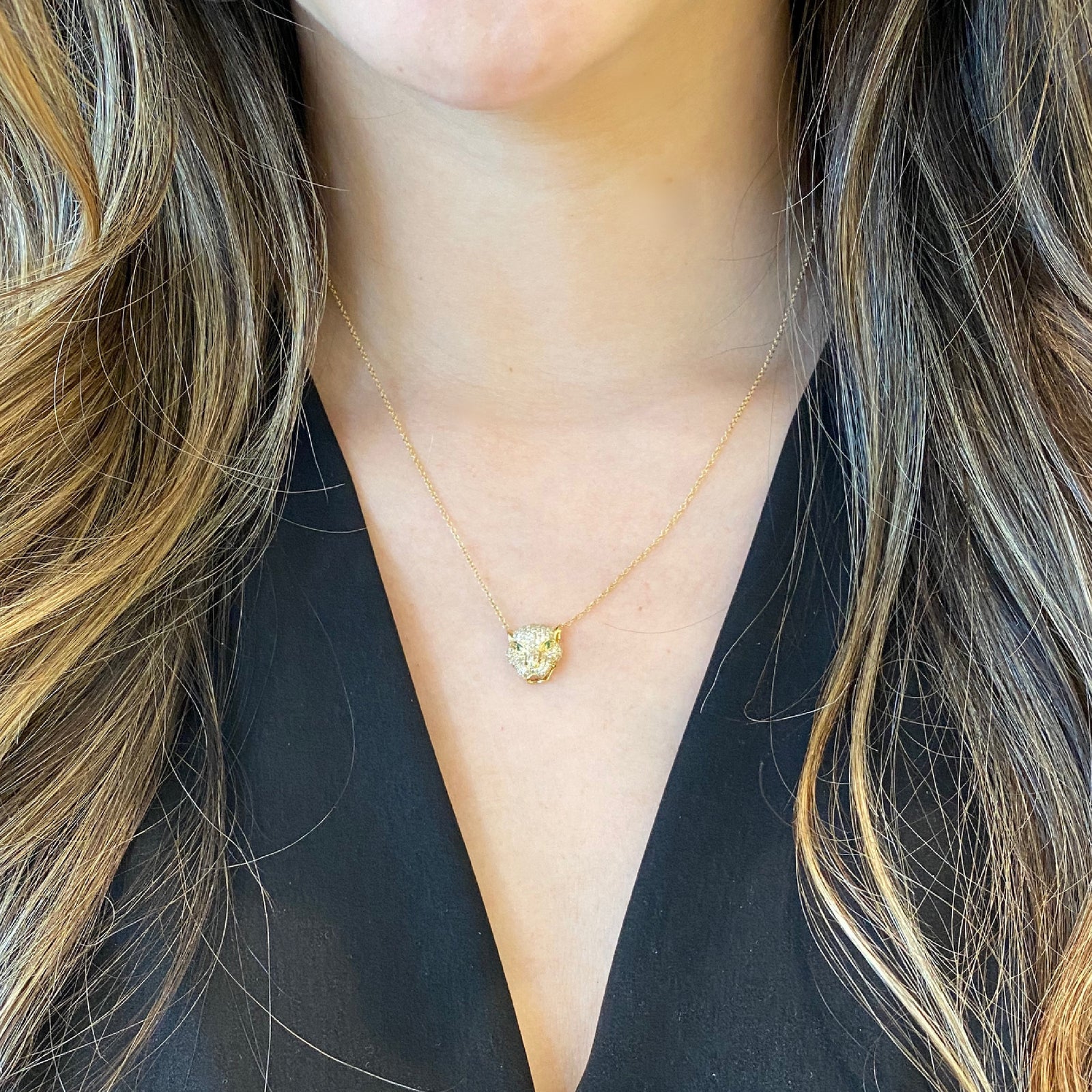 Diamond & Emerald Tiger Pendant Necklace -14K yellow gold weighing 2.72 grams -138 round pave set diamonds weighing 0.58 carats -2 emeralds weighing .02 ca