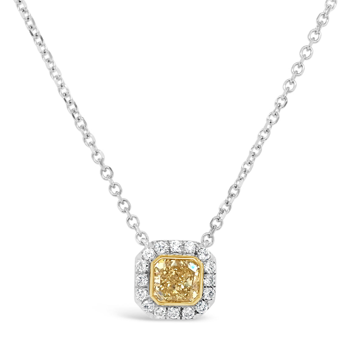 Yellow Diamond Pendant Necklace  -18K gold weighing 1.7 grams  -0.58 ct Fancy Yellow diamond; 14K gold setting weighing 1.9 grams  -16 round prong-set diamonds totaling 0.15 carats