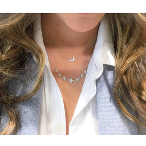 Female Model Wearing Diamond Graduated Star Necklace  -14K gold weighing 3.21 grams  -153 round pave-set diamonds totaling 0.37 carats.