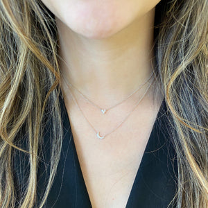 Female Model Wearing Petite Diamond Crescent Moon Necklace  -14k gold weighing 1.53 grams  -7 round prong set diamonds weighing .08 carats