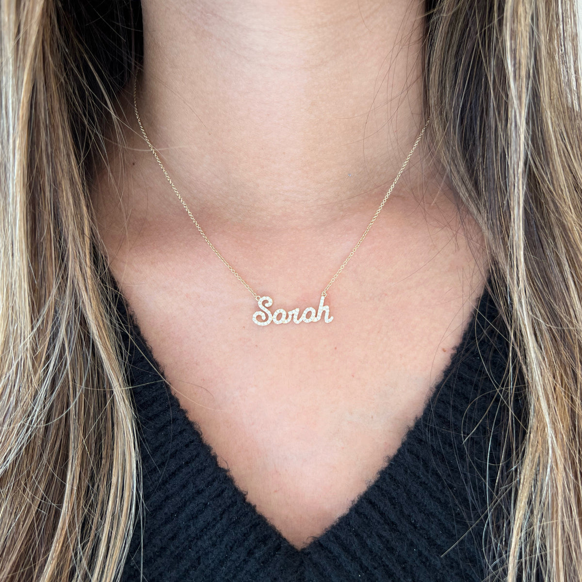 Female model wearing Diamond Nameplate Necklace - 14K yellow gold weighing 2.51 grams