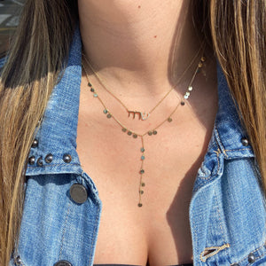 Female model wearing Diamond Hebrew Nameplate Pendant Necklace - 14K gold weighing 2.22 grams  - 20 round diamonds weighing 0.09 carats