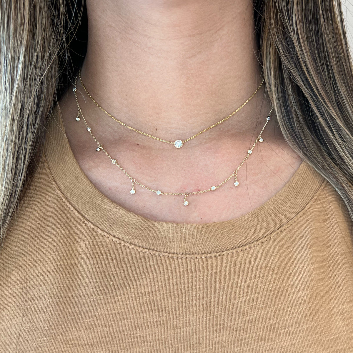 Female model wearing Diamond Fringe Necklace  14k yellow gold, 2.15 grams, 15 round diamonds weighing .27 carats.