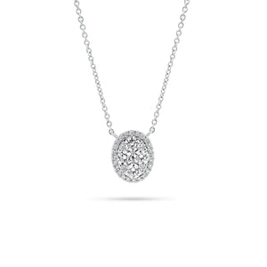 Diamond Halo Oval Pendant  - 18K white gold weighing 3.31 grams  - 34 round diamonds totaling 0.63 carats