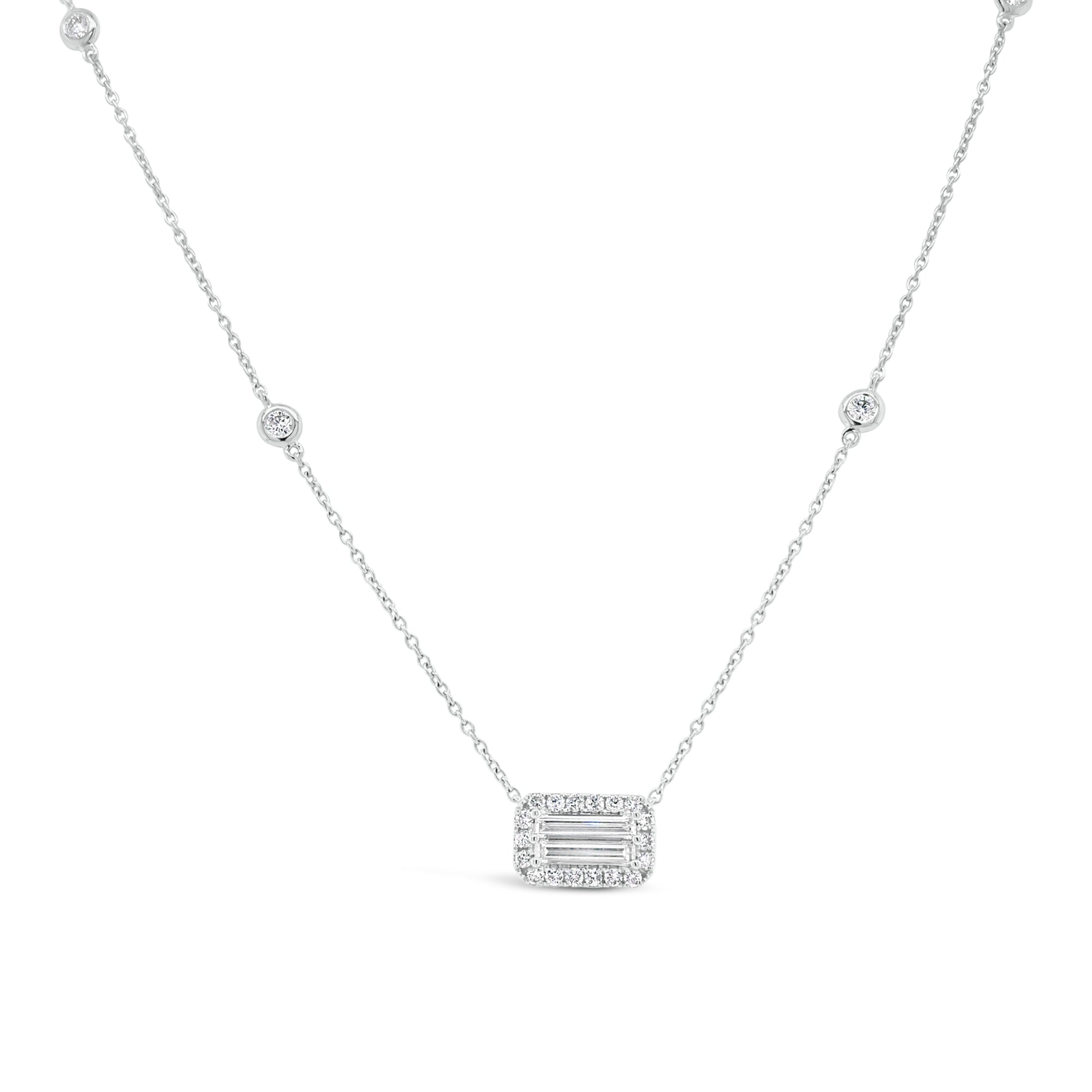 Diamond Baguette Pendant Necklace with Halo  -18K gold weighing 3.37 grams  -2 slim baguettes totaling 0.40 carats  -22 round diamonds totaling 0.33 carats